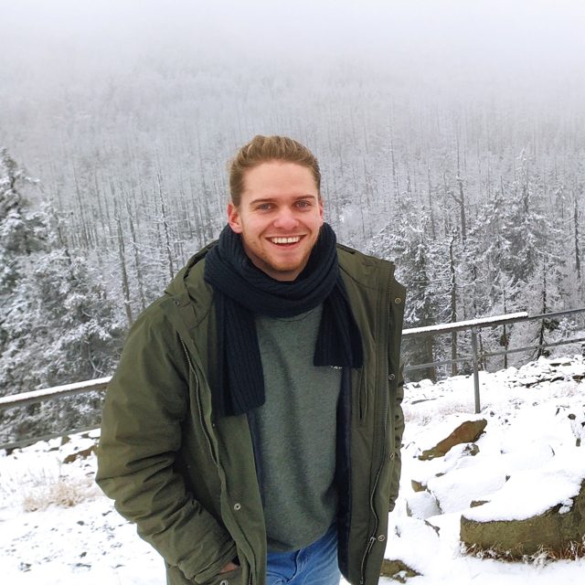 Stephan, managing director of Shortcut IT GmbH, smiling in front of a snowy forest.